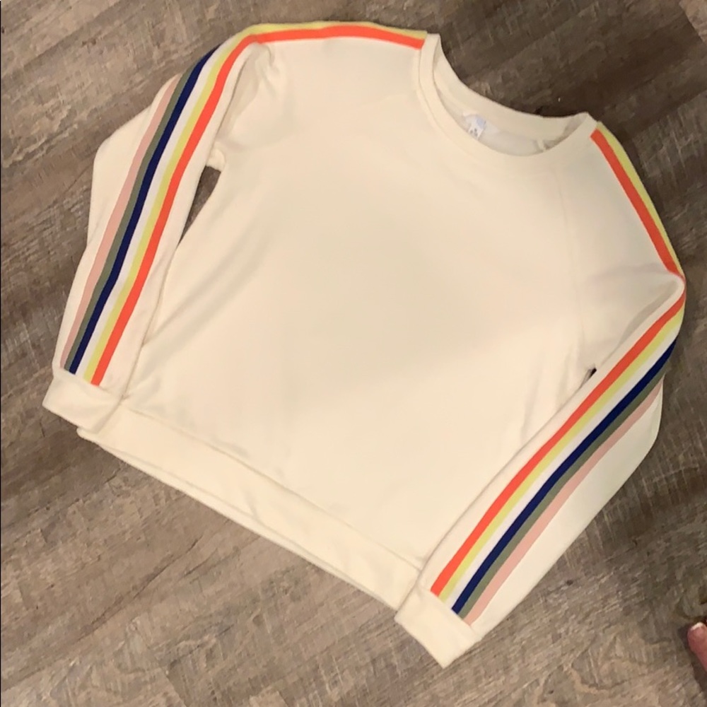 Cream sweater. Multi color striped arms